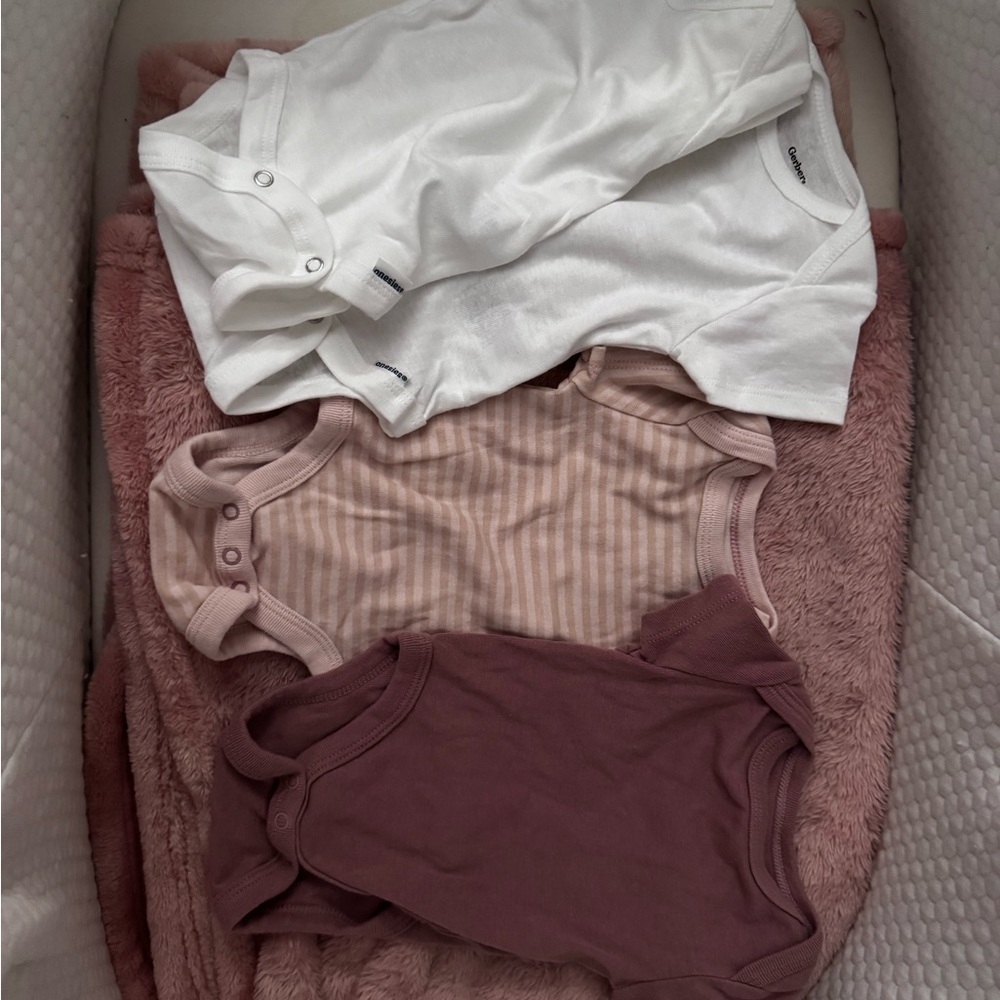 Set of Three Baby Bodysuits in White, Pink, and Mauve